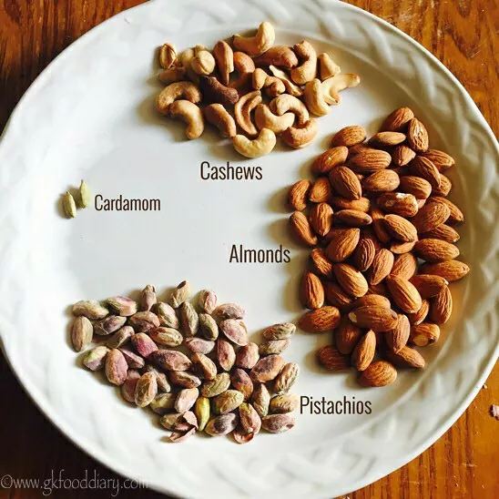Cardamom, cashew, almonds & pistachio in a plate for home-made protein powder for kids